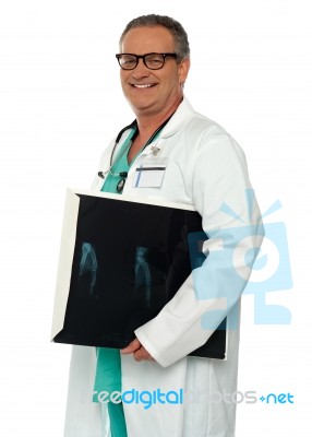 Smiling Male Doctor Holding X Ray Stock Photo