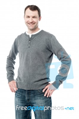 Smiling Man With Hands On Hips Stock Photo