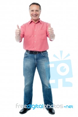 Smiling Man With Thumbs Up Sign Stock Photo