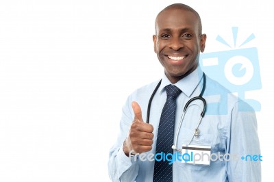 Smiling Medical Doctor Showing Thumbs Up Stock Photo