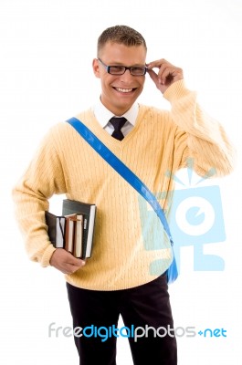 Smiling Student Holding His Books Stock Photo