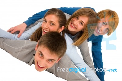 Smiling Teenagers Laying Stock Photo