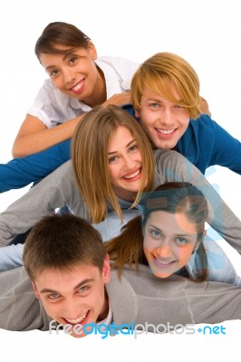 Smiling Teenagers Laying On Floor Stock Photo