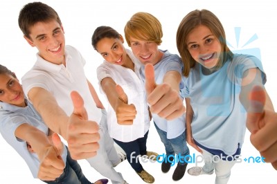 Smiling Teenagers Showing Thumbs Up Stock Photo