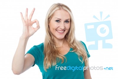 Smiling Woman Gesturing Perfect Sign Stock Photo
