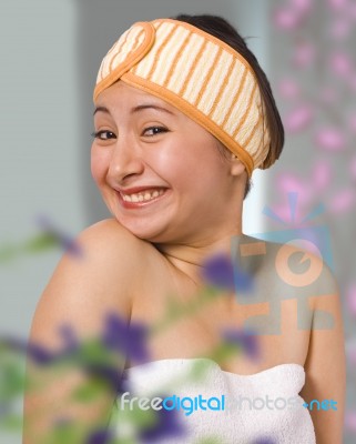 Smiling Woman In Her Bedroom Getting Dressed Stock Photo