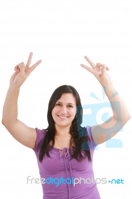 Smiling Woman Making Victory Sign Stock Photo