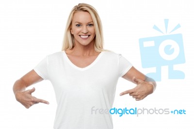 Smiling Woman Pointing Her Stomach Stock Photo