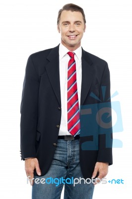 Smiling Young Businessperson Posing Casually Stock Photo
