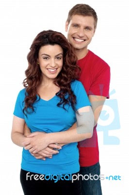 Smiling Young Couple Hugging Stock Photo