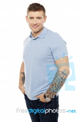 Smiling Young Guy Hands In Pocket Stock Photo