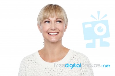 Snap Shot Of A Smiling Blonde Looking Upwards Stock Photo