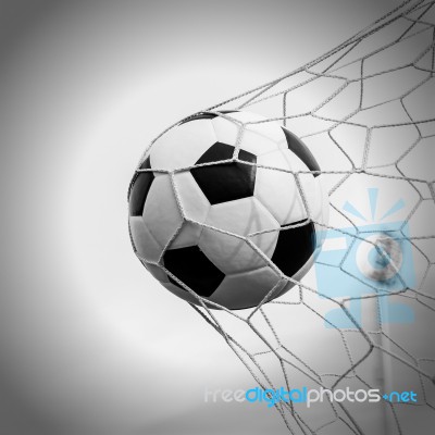 Soccer Football In Goal Net With The Sky Field Stock Photo