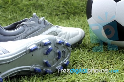 Soccer Shoes And Soccer Ball Stock Photo