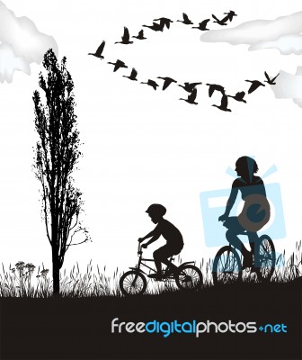 Son And Mother On Bikes Stock Image