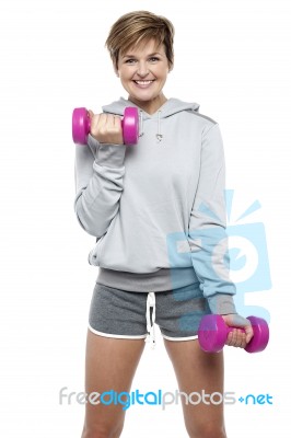 Sporty Middle Aged Woman With Dumbbells Stock Photo