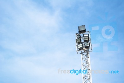 Spotlights Electric Poles With Blue Sky For Background Stock Photo
