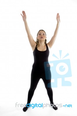 Standing Girl Stretching Her Arms Stock Photo