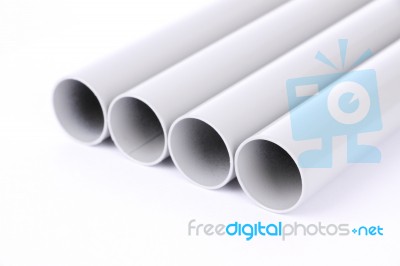 Steel Pipes Cut Front Focus Row On White Floor Stock Photo