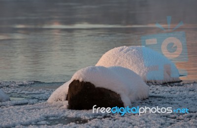 Ice-covered Stones In A River Stock Photo