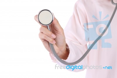 Stethoscope In Doctor Hand Isolated On White Background Stock Photo