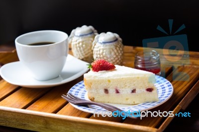 Strawberry Cheesecake And Hot Coffee Stock Photo