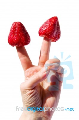 Strawberry On Fingers Stock Photo