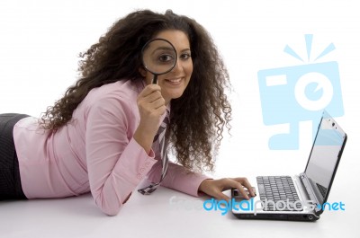 Student With Laptop And Magnifier Stock Photo