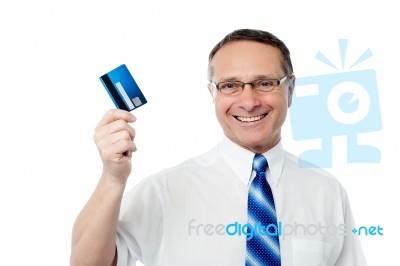 Successful Businessman Holding A Credit Card Stock Photo