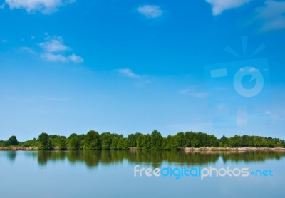 Summer Forest River With Reflection Of The Sky Stock Photo