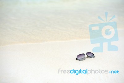 Sunglasses On The Beach Stock Photo