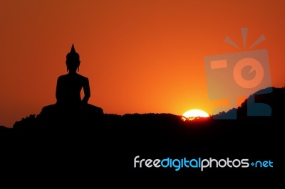 Sunset And Buddha Stock Photo