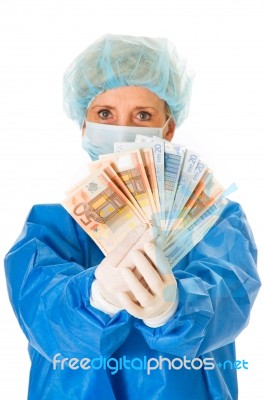 Surgeon Holding Banknotes Stock Photo