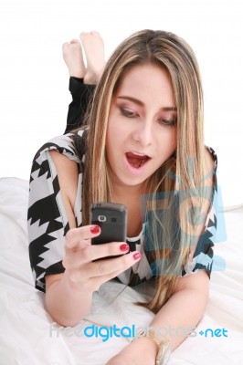 Surprised Girl Looking On Mobile Stock Photo