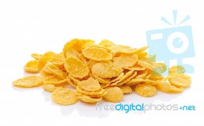 Sweet, Tasty Cornflakes, Dry Crispy On White Background Stock Photo