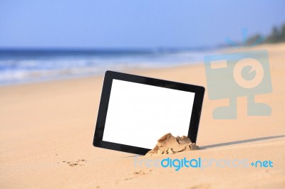 Tablet On Beach Stock Photo