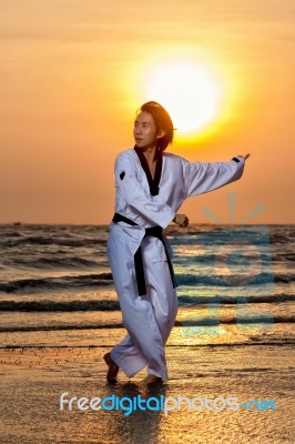 Taekwondo Man Training On Beach Stock Photo