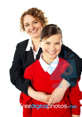Teacher Embracing Her Student From Back Stock Photo
