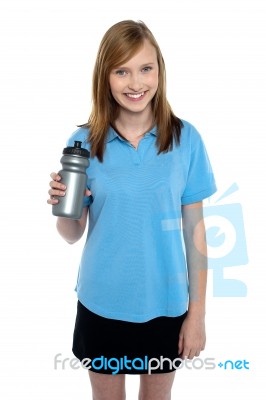 Teen In Sports Wear Posing With A Water Bottle Stock Photo