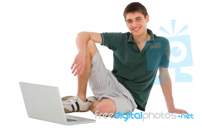 Teenage Boy Sitting On Floor Stock Photo