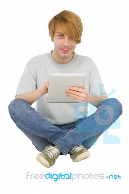 Teenage Boy Using Ipad Stock Photo
