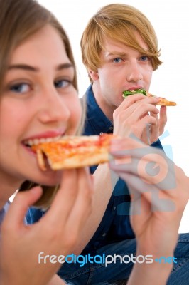 Teenage Couple Eating Pizza Stock Photo
