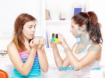 Teenage Girls Polishing Fingernails Stock Photo