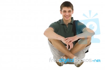 Teenage Student Sitting On Floor Stock Photo
