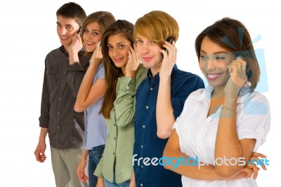 Teenagers Talking Over Phone Stock Photo