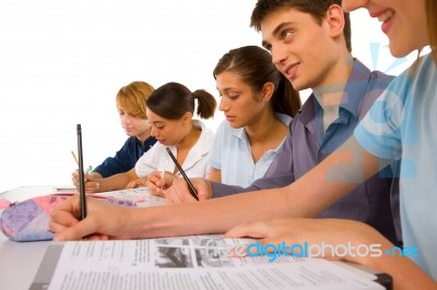 Teenagers Writing On Notebook Stock Photo
