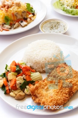 Thai Food, Rice, Mix Vegetables And Fried Fish Stock Photo