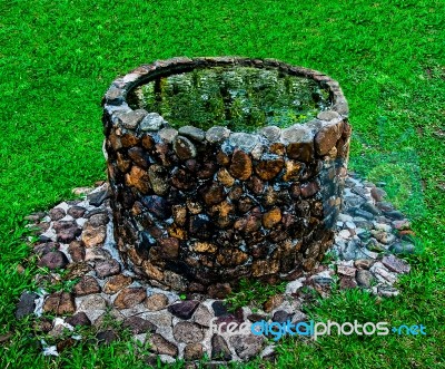 The Ancient Brick Well In Park Stock Photo