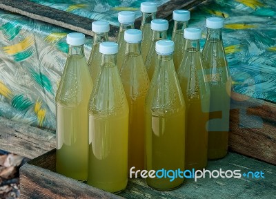 The Bottle Of Water Raw Palm Sugar In Thailand Stock Photo