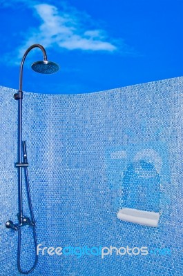 The Modern Shower Head In Restroom Isolated On Blue Sky Background Stock Photo
